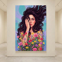 Artistic canvas print of a woman with long dark hair, hand covering face, surrounded by vibrant wildflowers and polka dot background.