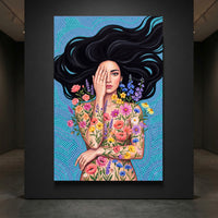 Vibrant portrait canvas print of a woman with dark hair, hand over face, adorned with bright, colorful flowers.
