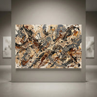 Abstract splatter art canvas print featuring beige, brown, black, and grey tones in a modern art gallery setting.