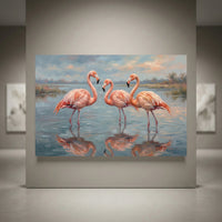 Oil painting style canvas print of three pink flamingos standing in calm water with reflections, soft landscape background.